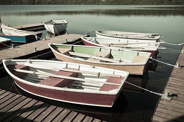 istock Floating Wooden Boats with Paddles 521953173