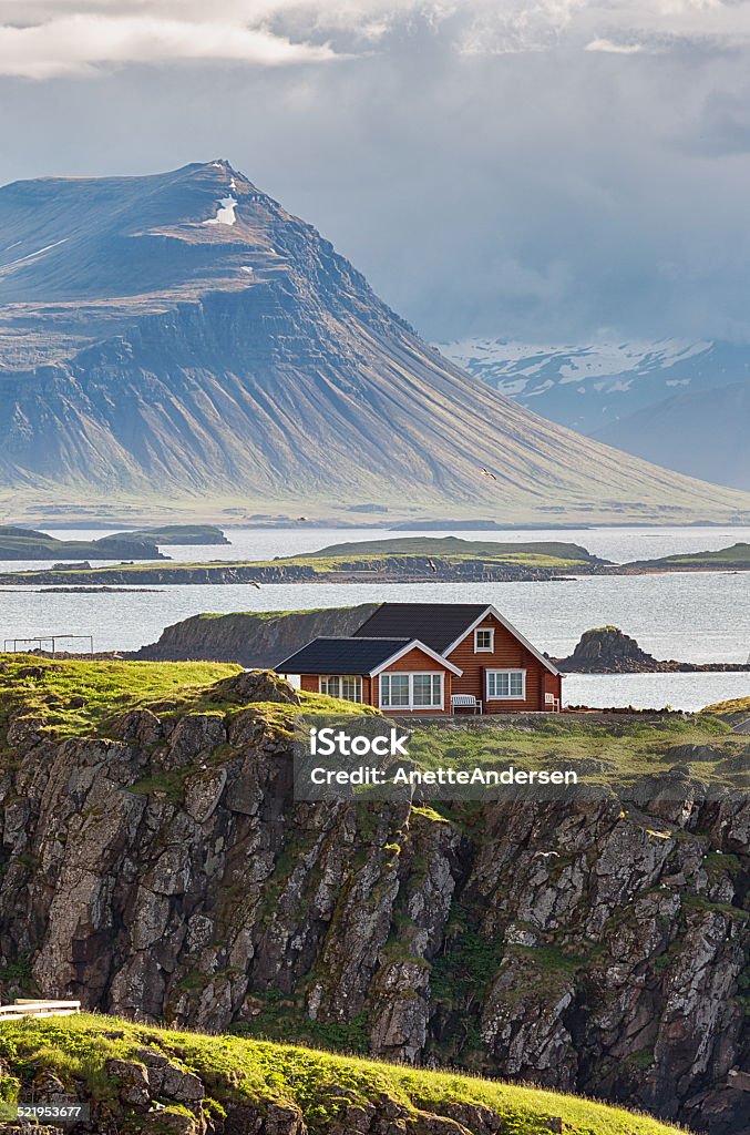 Idyllic red cottage in Iceland. Summer cabin in scenic landscape. Iceland Stock Photo