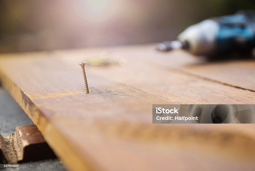 Drill links auf den Holzboden - Lizenzfrei Arbeiten Stock-Foto