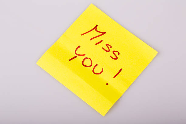 istock Yellow note paper miss you message 521955271