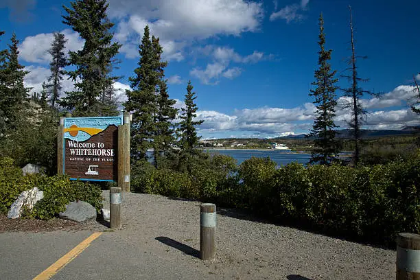 Sign along the Yukon River welcoming visitors to Whitehorse, Yukon, Canada
