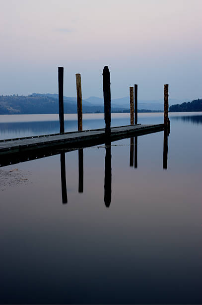 istock Reflection of dock at sunrise. 521958447