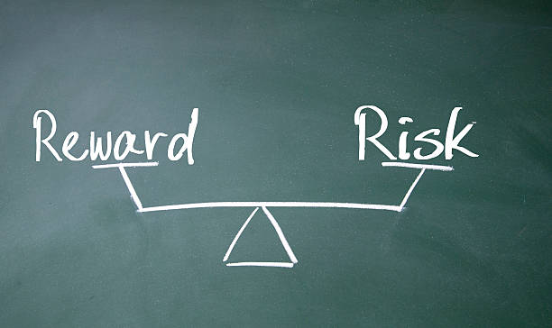 istock reward and risk balance sign 521958547