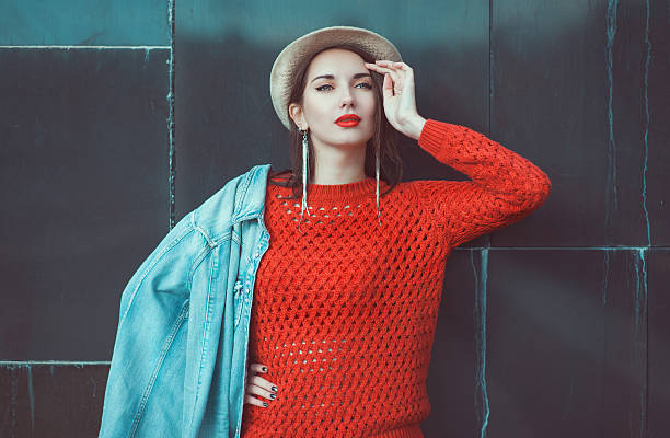 istock Young beautiful girl in red jersey with hat 521970973