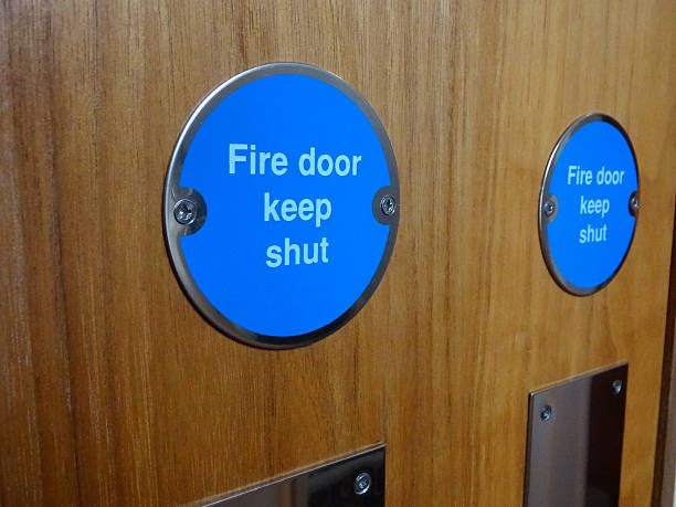 istock Image of circular blue Fire Door Keep Shut safety sign 521971619
