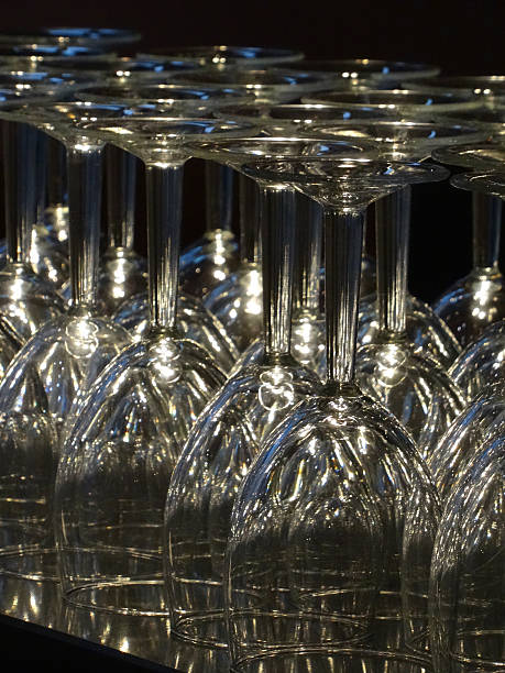 istock Image of upturned clear wine glasses sparkling in light, bar 521971649