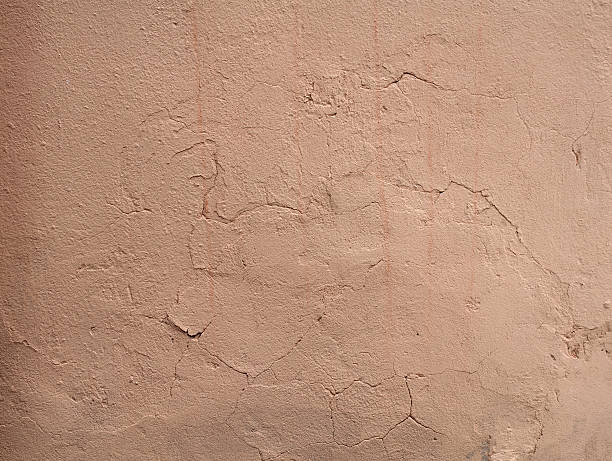istock Texture of old wall covered with pink stucco 521971669