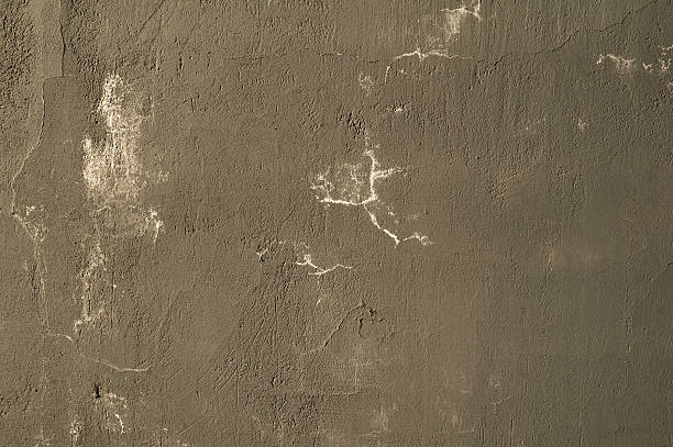 istock Texture of old wall covered with gray stucco 521972555