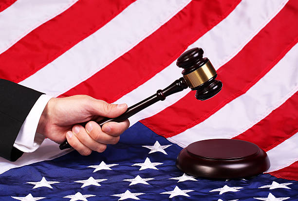 istock Gavel on Judge Hand over American Flag 521973447