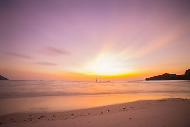 пляж и тропическое море - moody sky outdoors digital composite sunset стоковые фото и изображения