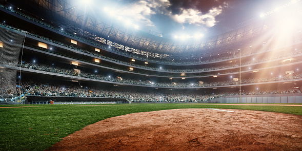 A wide angle of a outdoor baseball stadium full of spectators under a stormy night sky. The image has depth of field with the focus on the foreground part of the pitch. Stadium and all elements are made in 3D.