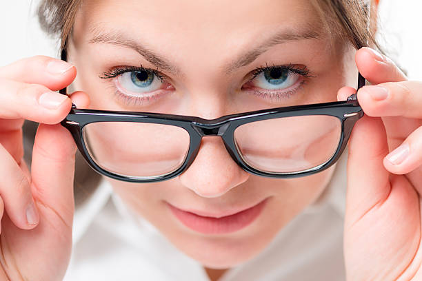 istock very attentive girl watching glasses having lowered 521975880
