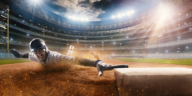 rutschen auf dritte base - baseball player baseball sport catching stock-fotos und bilder