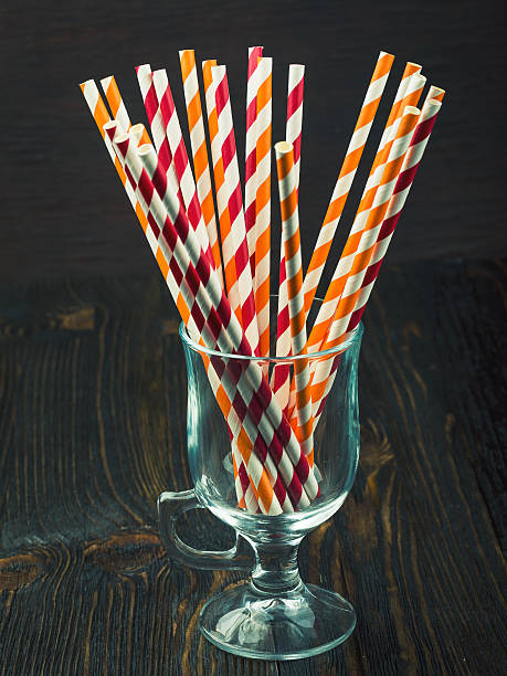istock Striped straws for cocktails in a glass 521977366