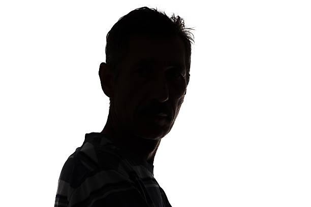 istock Silhouette of a man looking at camera 521977677