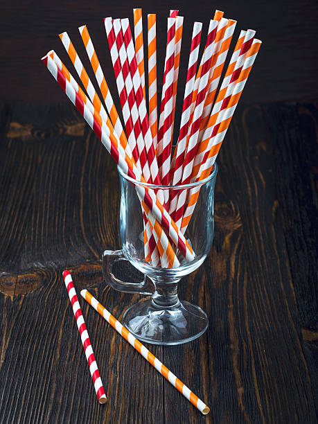 Striped straws for cocktails in a glass