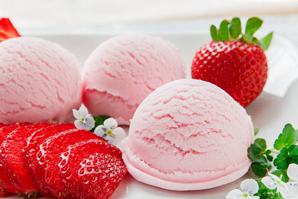 istock strawberry ice cream ball with fresh strawberries 521977934