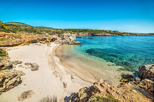 istock blue sea in a small cove in Sardinia 521978016
