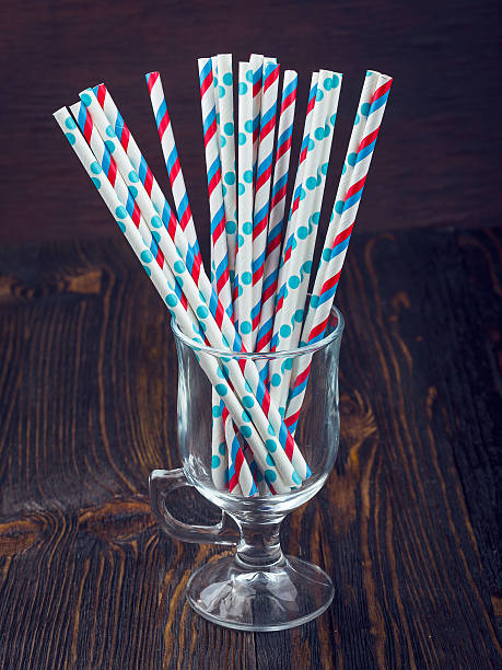 istock Striped straws for cocktails in a glass 521978034