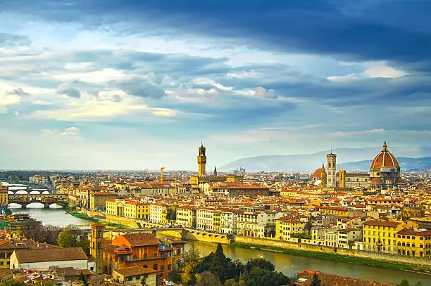 Florence sunset aerial cityscape. Panorama view from Michelangelo park square. From left Palazzo Vecchio and Duomo Cathedral. Italy