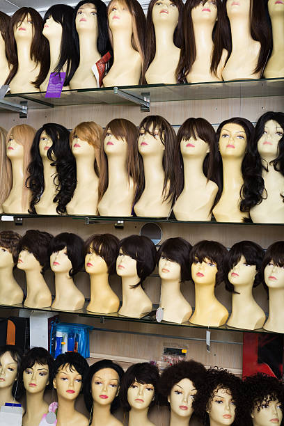 istock Dummies heads with hair style in shop 521978754