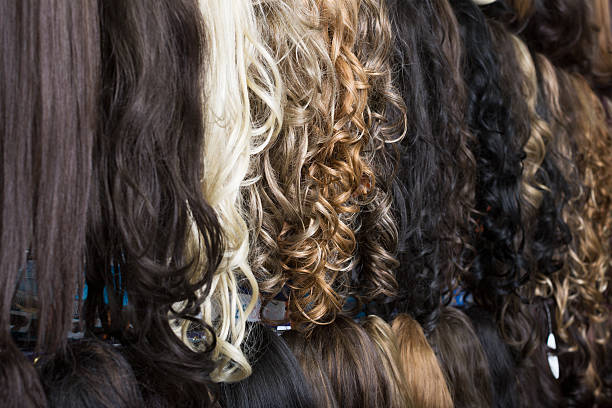istock Clip-in hair extensions in wig shop 521978828