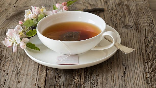 istock Closeup of teacup on wooden table 521979000