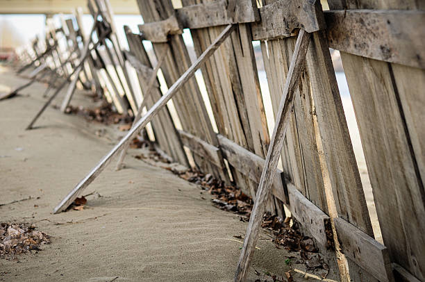 istock Wooden fence on the sand 521979986