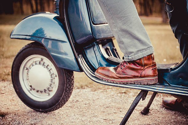 istock Man riding scooter along the street 521982282