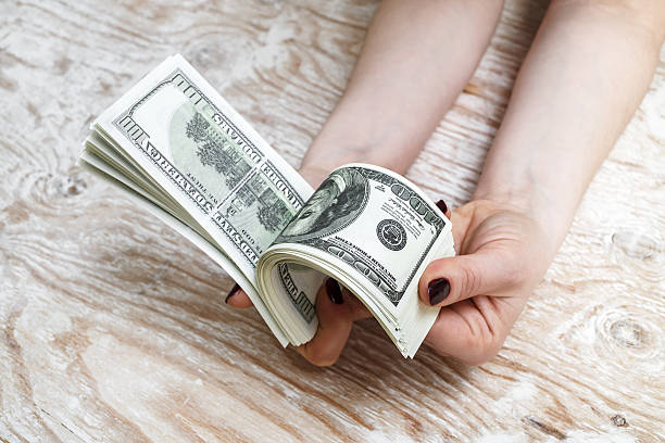 istock Woman counting money 521982734