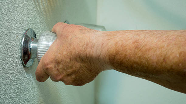 istock Wet hand conserving water in shower 521983242