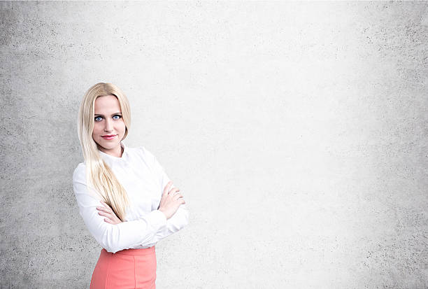 istock Businesswoman on concrete wall 521983524