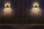 Empty spotlit room with flower pattern wallpaper