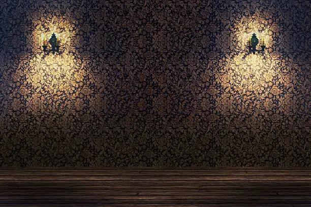 Empty spotlit room with flower pattern wallpaper.