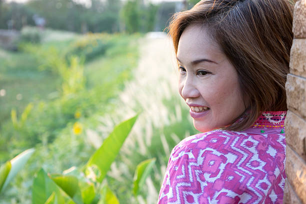 istock portrait woman side with view of Grass backlit 521991546