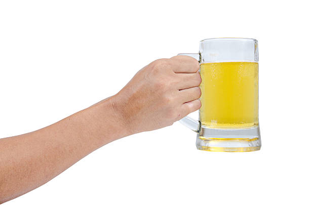 istock man hand with glass of beer 521992103