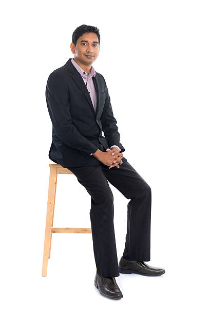 istock Full body indian business man sitting 521993562