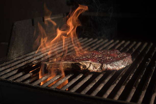 istock Steak cooking on BBq Flame Porterhouse 521994346