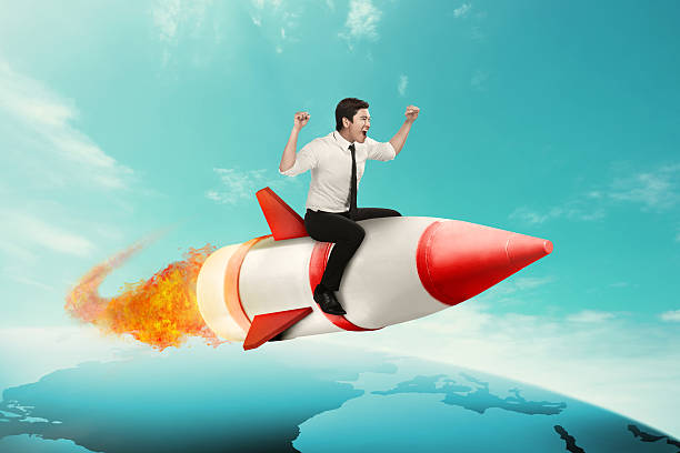 istock Business man riding rocket across the earth 521994598