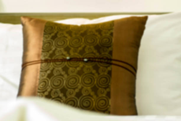 istock Comfortable armchair with pillows and blanket against 521995308