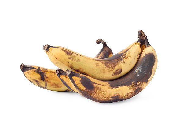 rotten ripe bananas rotten ripe bananas isolated on white background bruised fruit stock pictures, royalty-free photos & images