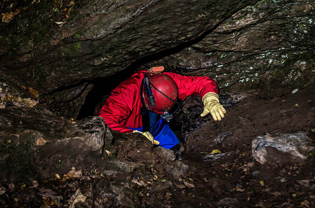 istock spelunking,caving,pot holing,speleology,exploration. colour image, 521996013