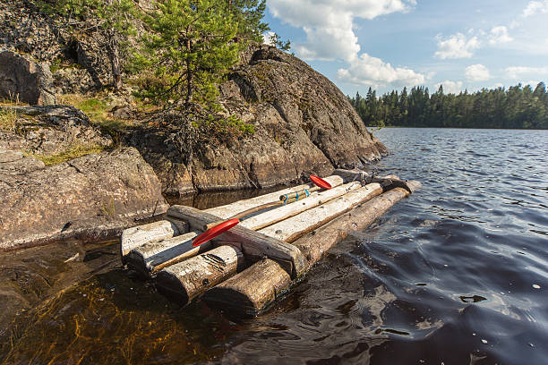 istock wooden raft at the rocky shore 521997068