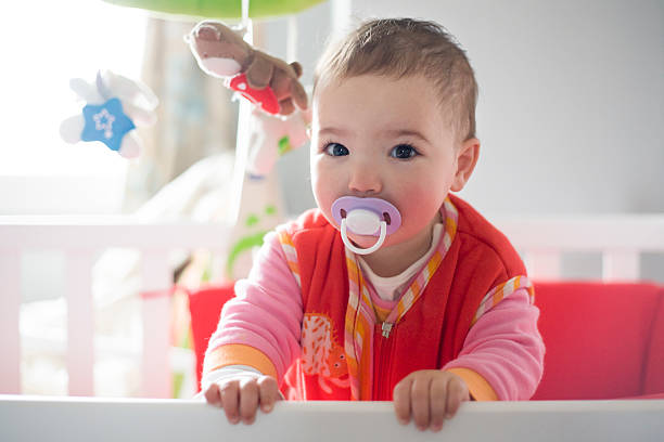 istock standing on the crib after awakening 521997500