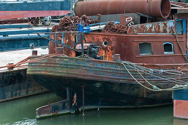 istock Details of a rusty old moored ship 521997513