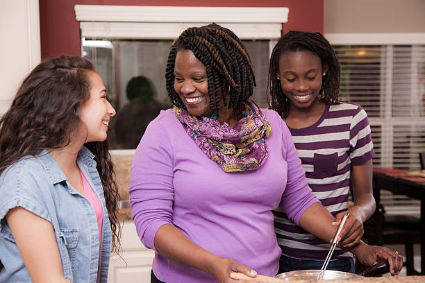 istock Multi-ethnic family at home cooking together in kitchen. 521997656