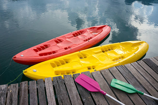 istock colorful canoes docked on a lake 521998533