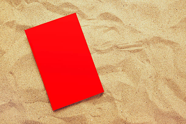 istock Book with red covers on summer vacation beach holiday 522000370
