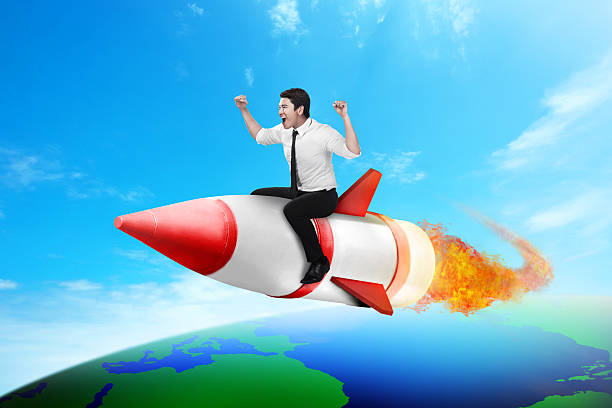 istock Business man riding rocket across the earth 522000866