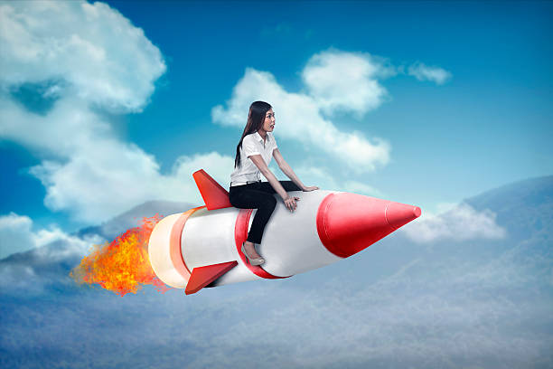 istock Asian business woman flying ride rocket 522002226